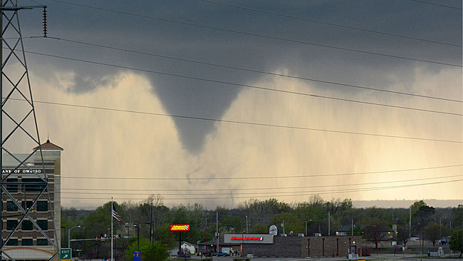 A tornado touches down in Tulsa, Okla., on Wednesday, March 30, 2016. The National Weather Service is confirming multiple tornado touchdowns in the Tulsa area. (AP Photo/Larry Papke)